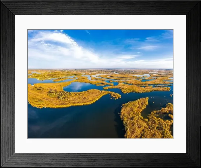 Framed Print : Top view of the beautiful Samarskie Plavni on the Dnieper with a village nearby in the warm evening light Framed Print : Top view of the beautiful Samarskie Plavni on the Dnieper with a village nearby in the warm evening light