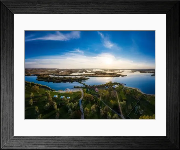 Framed Print : Top view of the beautiful Samarskie Plavni on the Dnieper with a village nearby in the warm evening light Framed Print : Top view of the beautiful Samarskie Plavni on the Dnieper with a village nearby in the warm evening light