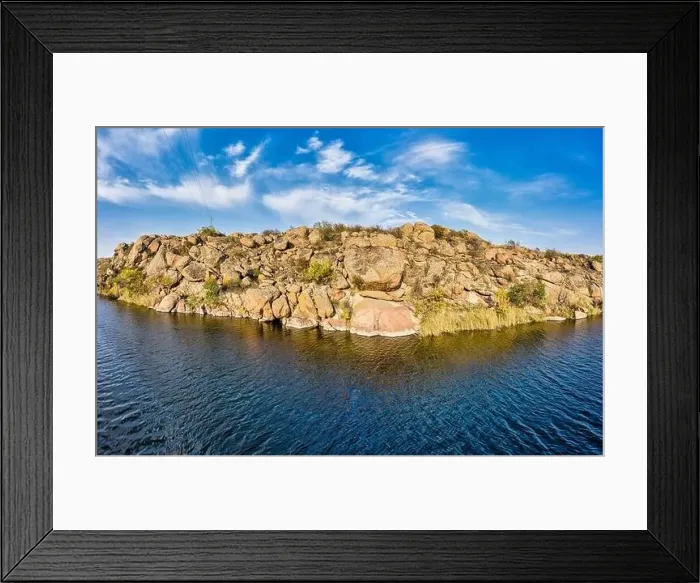 Framed Print : Among the large boulders, a smooth shining stream flows in the evening warm light in picturesque Ukraine