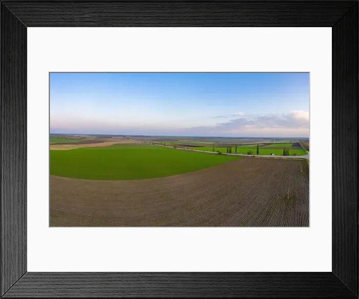 Framed Print : Flying over a field of growing wheat. Aerial panoramic drone shot Framed Print : Flying over a field of growing wheat. Aerial panoramic drone shot