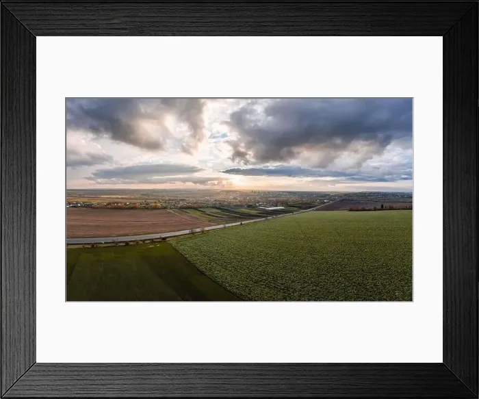 Framed Print : Flying over a field of growing wheat. Aerial panoramic drone shot Framed Print : Flying over a field of growing wheat. Aerial panoramic drone shot