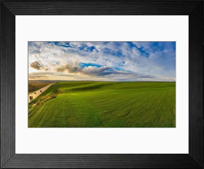 Framed Print : Flying over a field of growing wheat. Aerial panoramic drone shot Framed Print : Flying over a field of growing wheat. Aerial panoramic drone shot