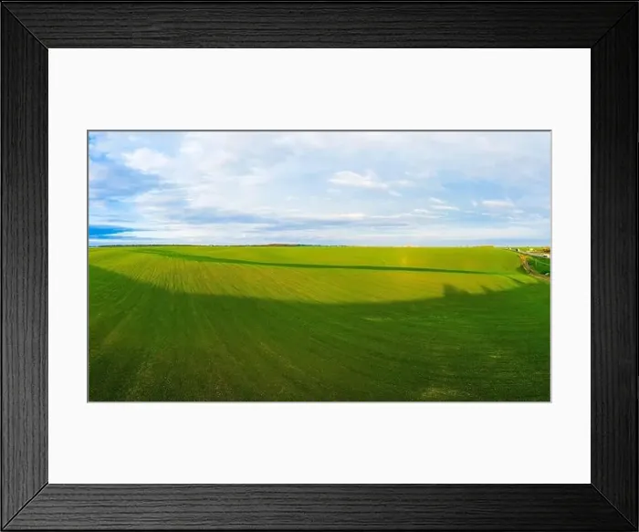 Framed Print : Flying over a field of growing wheat. Aerial panoramic drone shot Framed Print : Flying over a field of growing wheat. Aerial panoramic drone shot