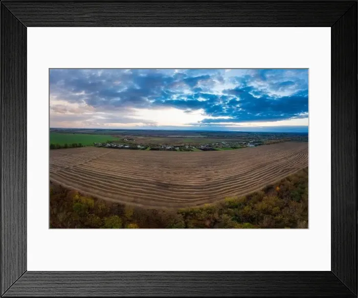 Framed Print : Flying over a field of growing wheat. Aerial panoramic drone shot Framed Print : Flying over a field of growing wheat. Aerial panoramic drone shot