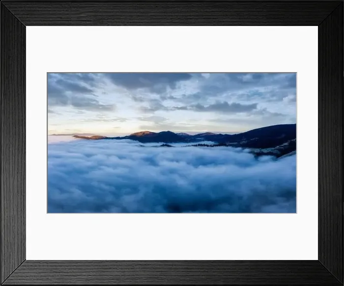 Framed Print : Sunrise over mountain hils covered with gray mist. Aerial panoramic drone shot Framed Print : Sunrise over mountain hils covered with gray mist. Aerial panoramic drone shot