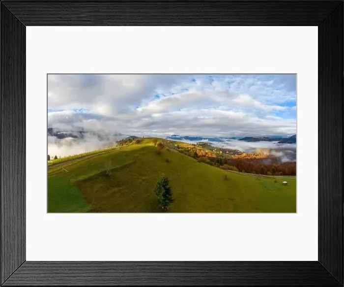 Framed Print : Sky with white and fluffy layer of clouds over green autumn hills, Aerial panoramic drone shot Framed Print : Sky with white and fluffy layer of clouds over green autumn hills, Aerial panoramic drone shot