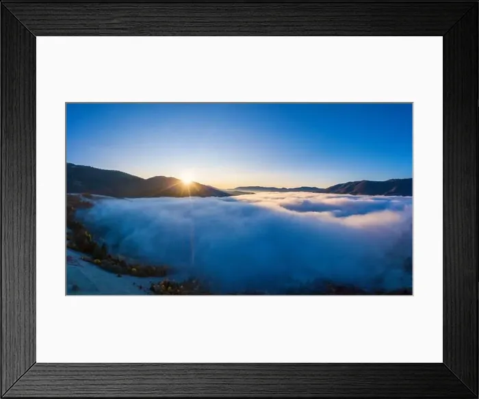 Framed Print : Sunrise over mountain hils covered with gray mist. Aerial panoramic drone shot Framed Print : Sunrise over mountain hils covered with gray mist. Aerial panoramic drone shot