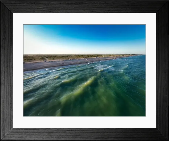 Framed Print : The edge of the sea in the evening sun. Camping beach. Drone shot 4K Framed Print : The edge of the sea in the evening sun. Camping beach. Drone shot 4K
