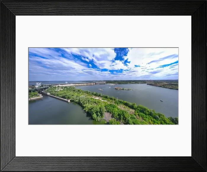 Framed Print : The beautiful river is surrounded by green and fresh vegetation in the city Framed Print : The beautiful river is surrounded by green and fresh vegetation in the city