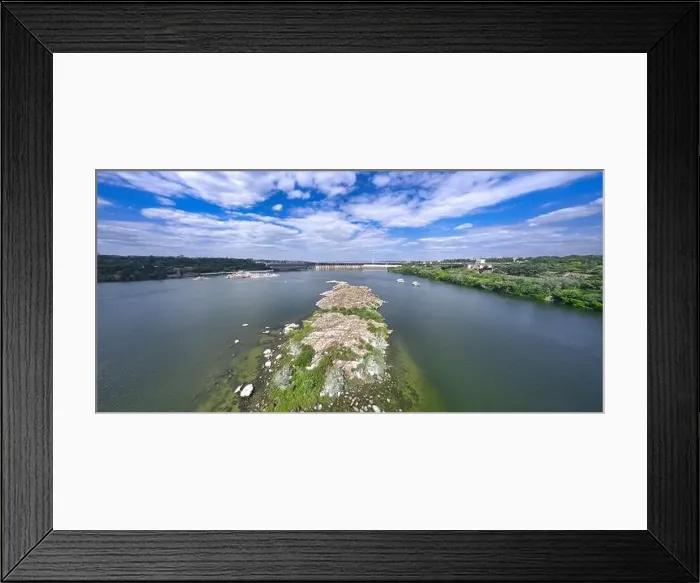 Framed Print : The beautiful river is surrounded by green and fresh vegetation in the city Framed Print : The beautiful river is surrounded by green and fresh vegetation in the city