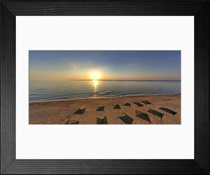 Framed Print : Beach umbrellas at sunrise. Sea current swims against the waves on the beautiful sea Framed Print : Beach umbrellas at sunrise. Sea current swims against the waves on the beautiful sea