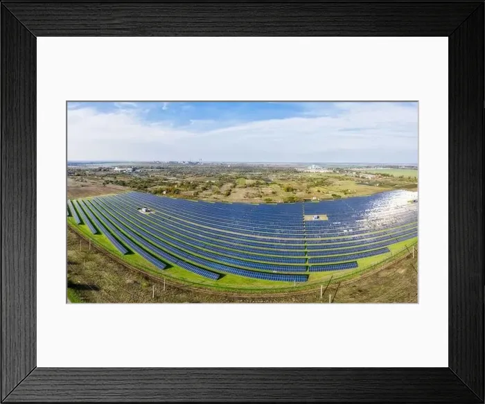 Framed Print : Huge solar power plant to use solar energy in a picturesque green field in Ukraine. Aerial panoramic drone shot