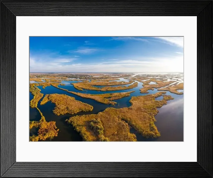 Framed Print : Top view of the beautiful Samarskie Plavni on the Dnieper with a village nearby in the warm evening light Framed Print : Top view of the beautiful Samarskie Plavni on the Dnieper with a village nearby in the warm evening light