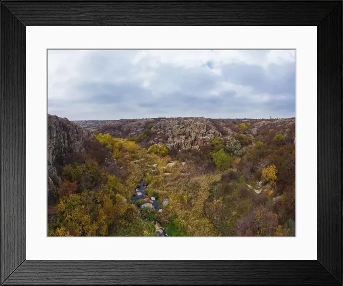 Framed Print : A small fast stream Kamenka in the wilderness in the evening light in Ukraine. Aerial panoramic drone shot Framed Print : A small fast stream Kamenka in the wilderness in the evening light in Ukraine. Aerial panoramic drone shot