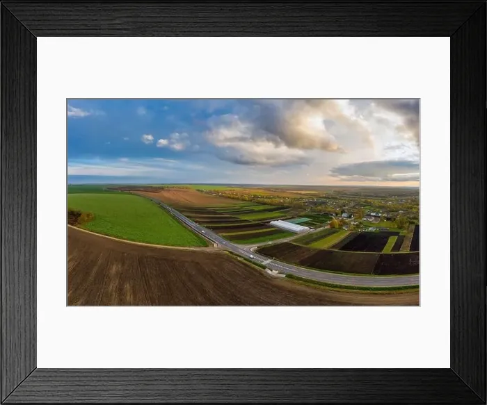 Framed Print : Flying over a field of growing wheat. Aerial panoramic drone shot Framed Print : Flying over a field of growing wheat. Aerial panoramic drone shot