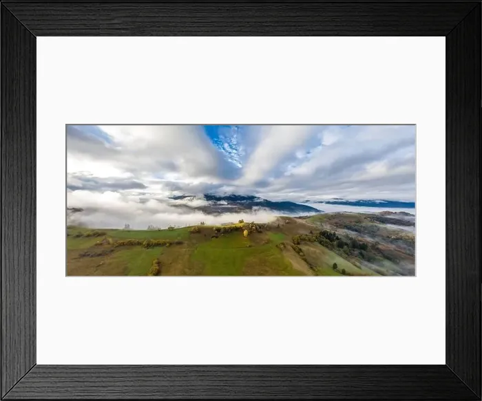 Framed Print : Sky with white and fluffy layer of clouds over green autumn hills, Aerial panoramic drone shot Framed Print : Sky with white and fluffy layer of clouds over green autumn hills, Aerial panoramic drone shot