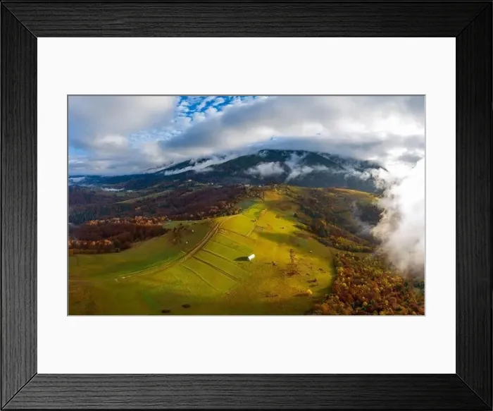 Framed Print : Sky with white and fluffy layer of clouds over green autumn hills, Aerial panoramic drone shot Framed Print : Sky with white and fluffy layer of clouds over green autumn hills, Aerial panoramic drone shot