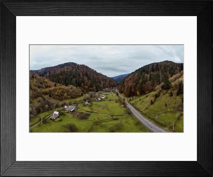 Framed Print : Small village in a mountain valley of the Carpathian Mountains on an autumn day in Ukraine along a road Framed Print : Small village in a mountain valley of the Carpathian Mountains on an autumn day in Ukraine along a road