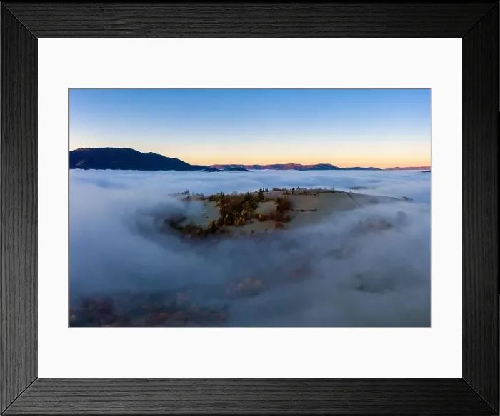 Framed Print : Sunrise over mountain hils covered with gray mist. Aerial panoramic drone shot Framed Print : Sunrise over mountain hils covered with gray mist. Aerial panoramic drone shot