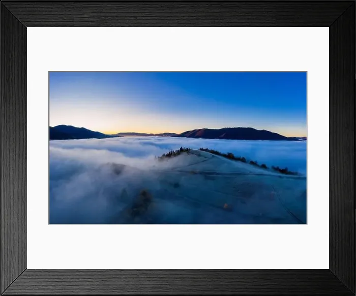 Framed Print : Sunrise over mountain hils covered with gray mist. Aerial panoramic drone shot Framed Print : Sunrise over mountain hils covered with gray mist. Aerial panoramic drone shot