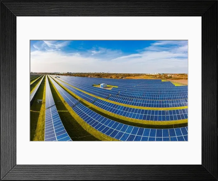 Framed Print : Huge solar power plant to use solar energy in a picturesque green field in Ukraine. Aerial panoramic drone shot Framed Print : Huge solar power plant to use solar energy in a picturesque green field in Ukraine. Aerial panoramic drone shot