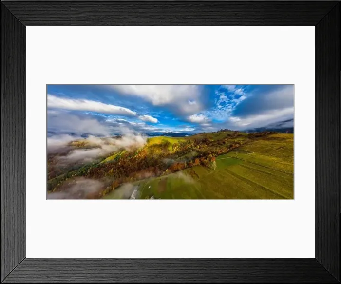 Framed Print : Sky with white and fluffy layer of clouds over green autumn hills, Aerial panoramic drone shot Framed Print : Sky with white and fluffy layer of clouds over green autumn hills, Aerial panoramic drone shot