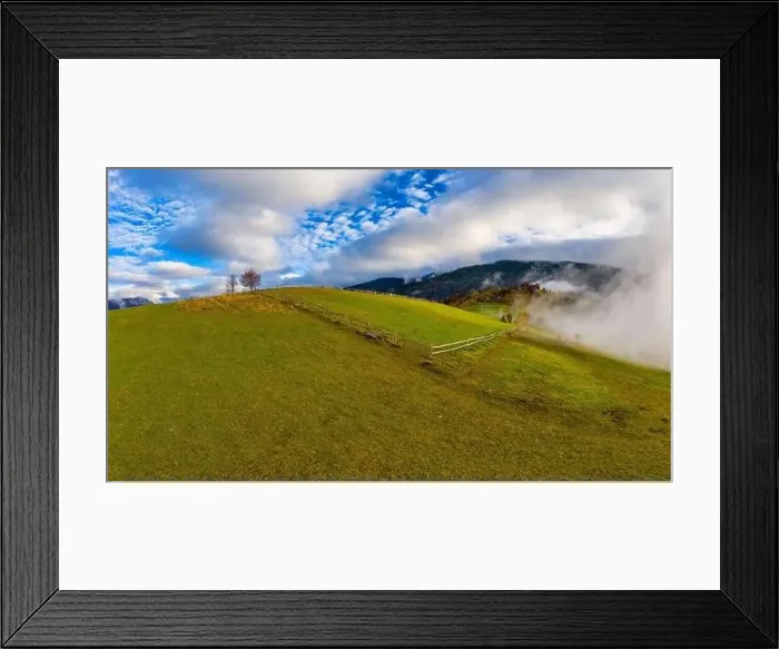 Framed Print : Sky with white and fluffy layer of clouds over green autumn hills, Aerial panoramic drone shot Framed Print : Sky with white and fluffy layer of clouds over green autumn hills, Aerial panoramic drone shot