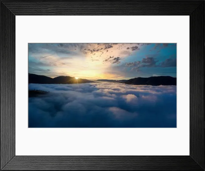 Framed Print : Sunrise over mountain hils covered with gray mist. Aerial panoramic drone shot Framed Print : Sunrise over mountain hils covered with gray mist. Aerial panoramic drone shot