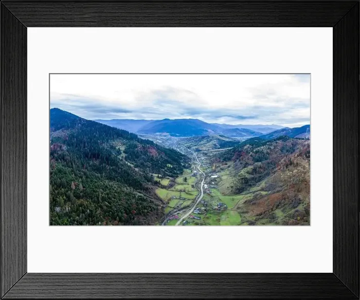 Framed Print : Small village in a mountain valley of the Carpathian Mountains on an autumn day in Ukraine along a road Framed Print : Small village in a mountain valley of the Carpathian Mountains on an autumn day in Ukraine along a road