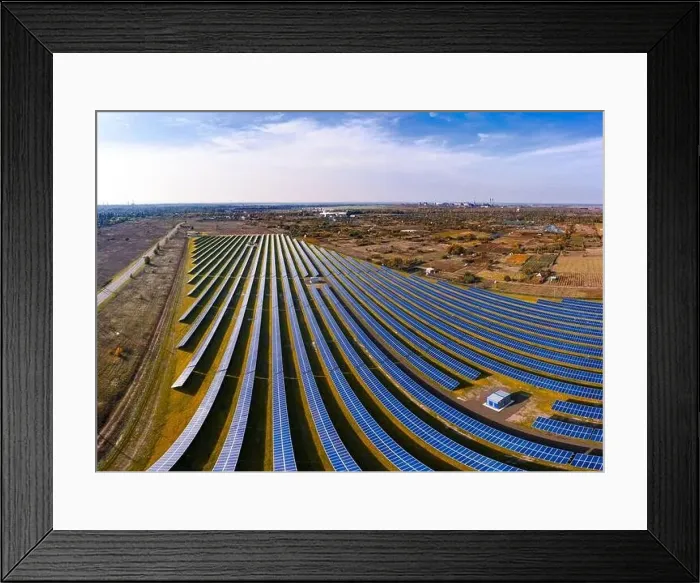 Framed Print : Huge solar power plant to use solar energy in a picturesque green field in Ukraine. Aerial panoramic drone shot Framed Print : Huge solar power plant to use solar energy in a picturesque green field in Ukraine. Aerial panoramic drone shot