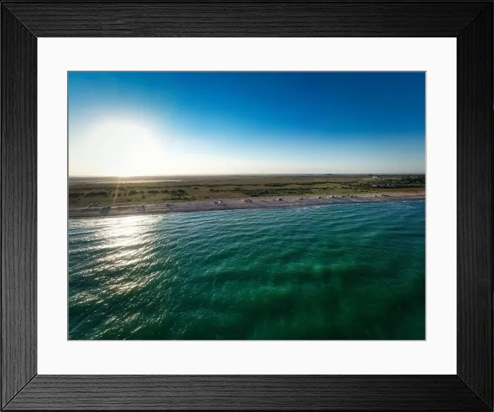 Framed Print : The edge of the sea in the evening sun. Camping beach. Drone shot 4K Framed Print : The edge of the sea in the evening sun. Camping beach. Drone shot 4K