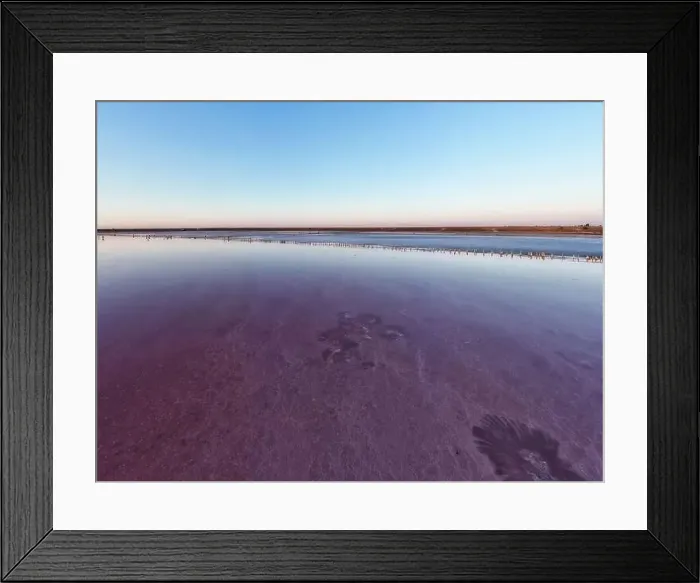 Framed Print : Top view of a shiny salty pink lake and a path along it Framed Print : Top view of a shiny salty pink lake and a path along it