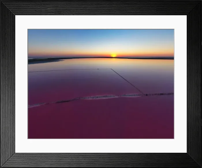 Framed Print : Top view of a shiny salty pink lake and a path along it Framed Print : Top view of a shiny salty pink lake and a path along it