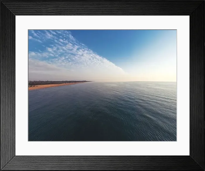 Framed Print : The edge of the sea in the evening sun. Camping beach. Drone shot 4K Framed Print : The edge of the sea in the evening sun. Camping beach. Drone shot 4K