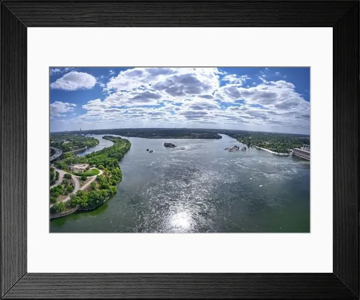 Framed Print : The beautiful river is surrounded by green and fresh vegetation in the city Framed Print : The beautiful river is surrounded by green and fresh vegetation in the city