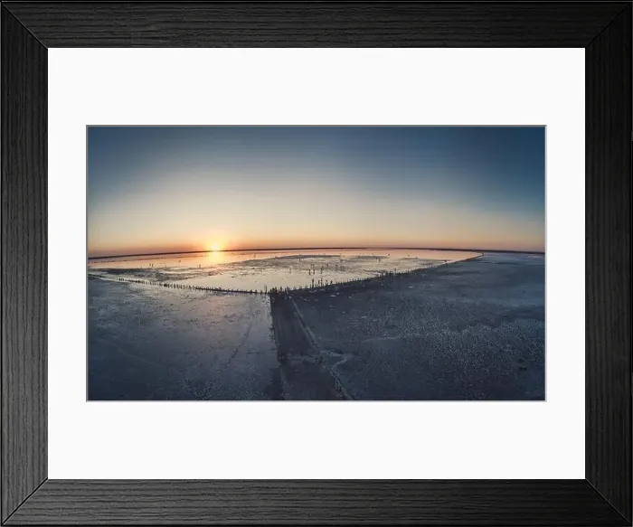 Framed Print : Top view of a shiny salty pink lake and a path along it Framed Print : Top view of a shiny salty pink lake and a path along it