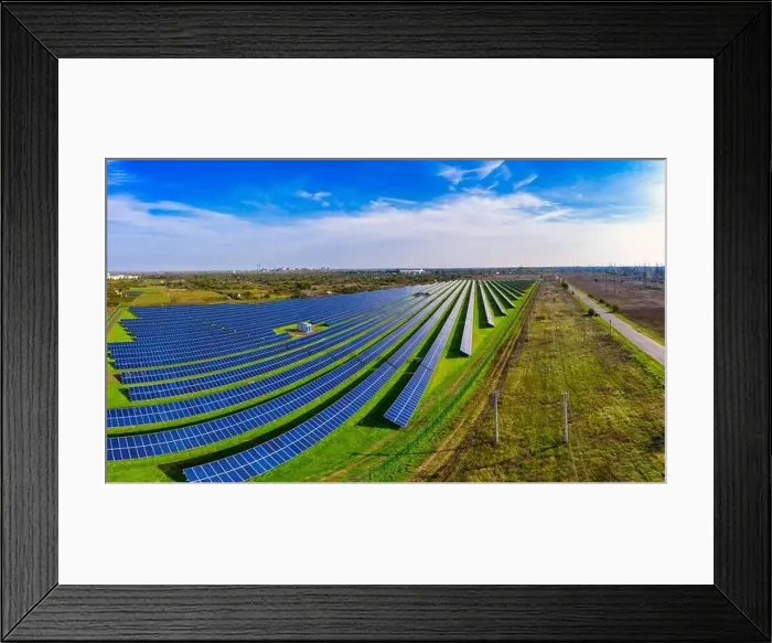 Framed Print : Huge solar power plant to use solar energy in a picturesque green field in Ukraine. Aerial panoramic drone shot Framed Print : Huge solar power plant to use solar energy in a picturesque green field in Ukraine. Aerial panoramic drone shot