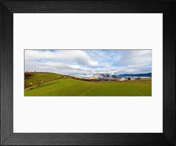Framed Print : Sky with white and fluffy layer of clouds over green autumn hills, Aerial panoramic drone shot Framed Print : Sky with white and fluffy layer of clouds over green autumn hills, Aerial panoramic drone shot