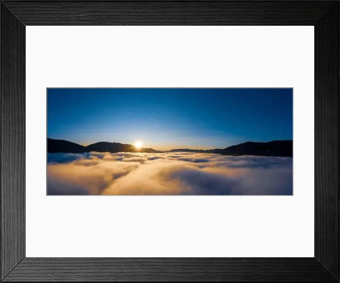 Framed Print : Sunrise over mountain hils covered with gray mist. Aerial panoramic drone shot Framed Print : Sunrise over mountain hils covered with gray mist. Aerial panoramic drone shot
