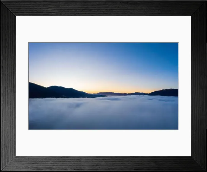 Framed Print : Sunrise over mountain hils covered with gray mist. Aerial panoramic drone shot Framed Print : Sunrise over mountain hils covered with gray mist. Aerial panoramic drone shot