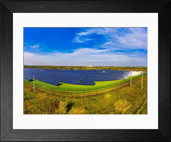 Framed Print : Huge solar power plant to use solar energy in a picturesque green field in Ukraine. Aerial panoramic drone shot Framed Print : Huge solar power plant to use solar energy in a picturesque green field in Ukraine. Aerial panoramic drone shot