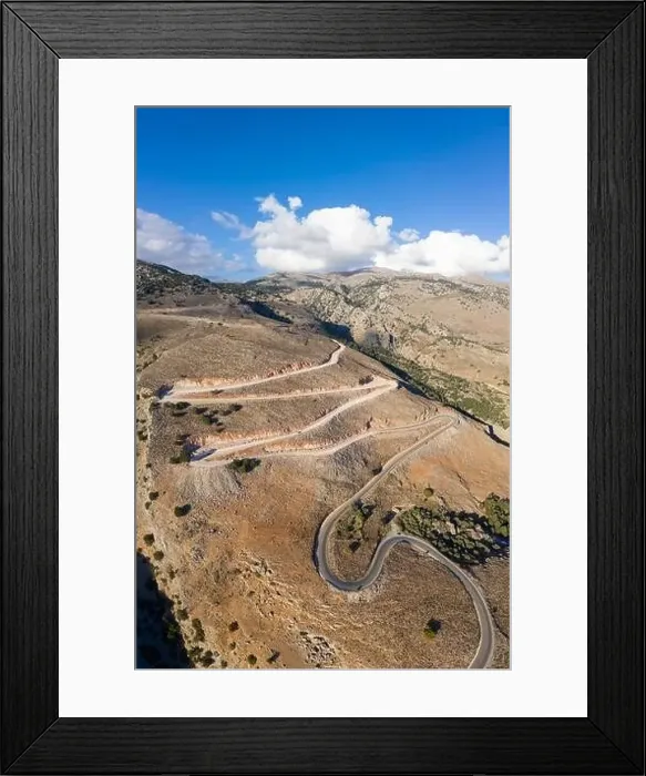 Framed Print : Aerial view of the winding road to the town of Hora Skafion on the south coast of Crete, Greece Framed Print : Aerial view of the winding road to the town of Hora Skafion on the south coast of Crete, Greece