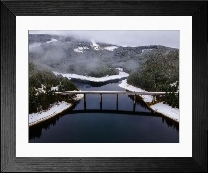 Framed Print : Drone photography from a high altitude of a road and a bridge crossing a mountain lake Framed Print : Drone photography from a high altitude of a road and a bridge crossing a mountain lake