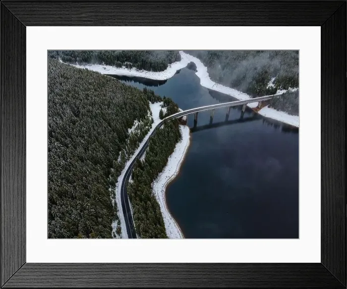 Framed Print : Drone photography from a high altitude of a road and a bridge crossing a mountain lake Framed Print : Drone photography from a high altitude of a road and a bridge crossing a mountain lake