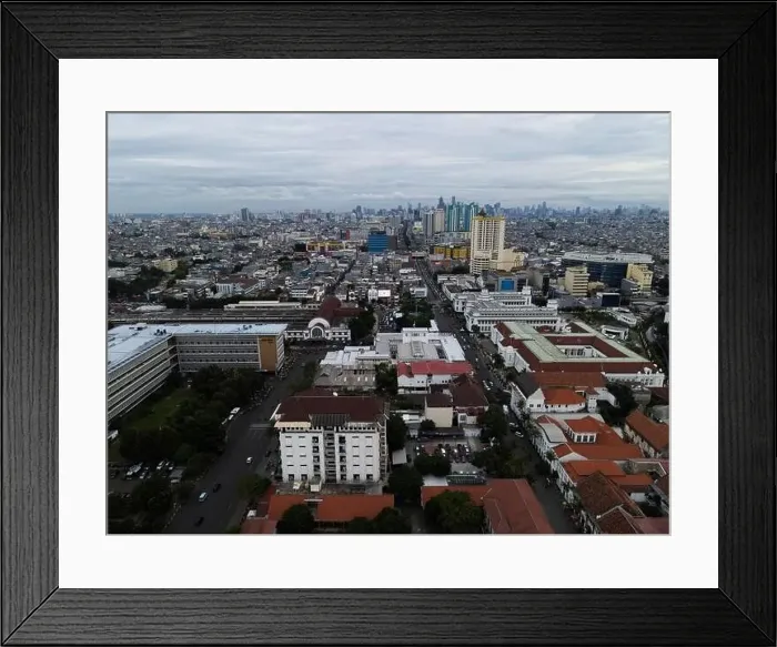 Framed Print : Aerial view of Jakarta Kota Train Station with Jakarta cityscape background. JAKARTA, INDONESIA - DECEMBER, 30, 2020 Framed Print : Aerial view of Jakarta Kota Train Station with Jakarta cityscape background. JAKARTA, INDONESIA - DECEMBER, 30, 2020