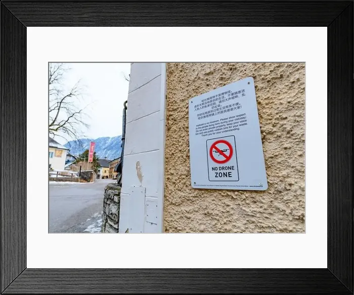 Framed Print : hallstatt, austria, 08 jan 2021, sign forbigging drone flights in the old town