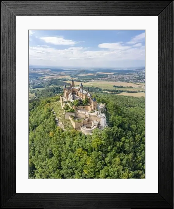 Framed Print : Aerial drone shot of Medival Hohenzollern Castle on hill near Stuttgart at summer noon Framed Print : Aerial drone shot of Medival Hohenzollern Castle on hill near Stuttgart at summer noon