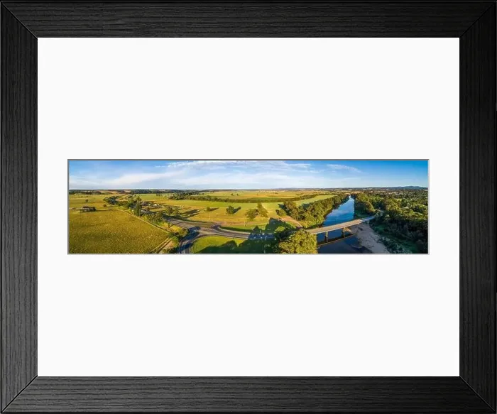 Framed Print : Wide aerial panorama of Princes Highway passing through Australian countryside at sunset Framed Print : Wide aerial panorama of Princes Highway passing through Australian countryside at sunset