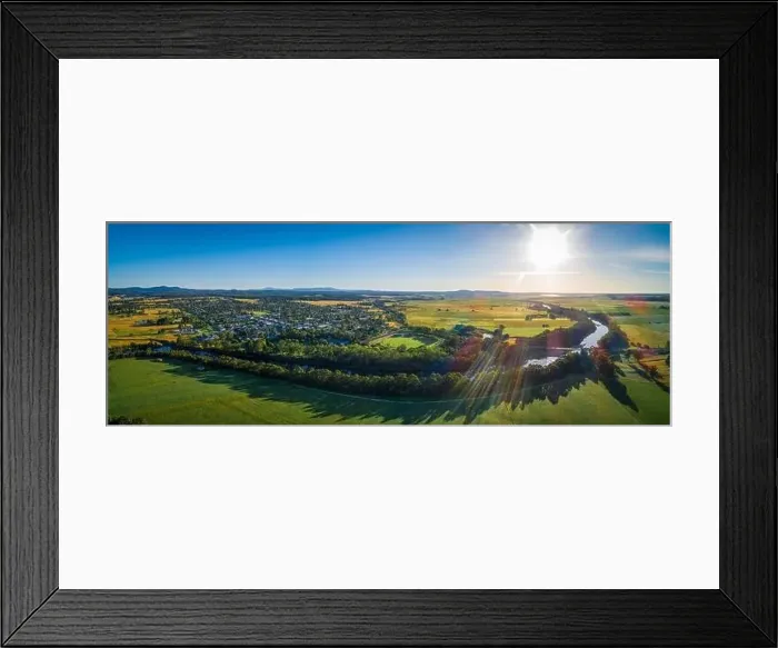 Framed Print : Snowy River meanders around small rural town and meadows at sunset - aerial panoramic landscape Framed Print : Snowy River meanders around small rural town and meadows at sunset - aerial panoramic landscape