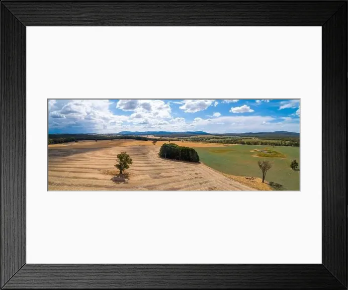 Framed Print : Aerial panorama of scenic fields and grasslands on bright summer day in Australia Framed Print : Aerial panorama of scenic fields and grasslands on bright summer day in Australia